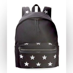 Saint Laurent, black canvas backpack with silver leather star detail.